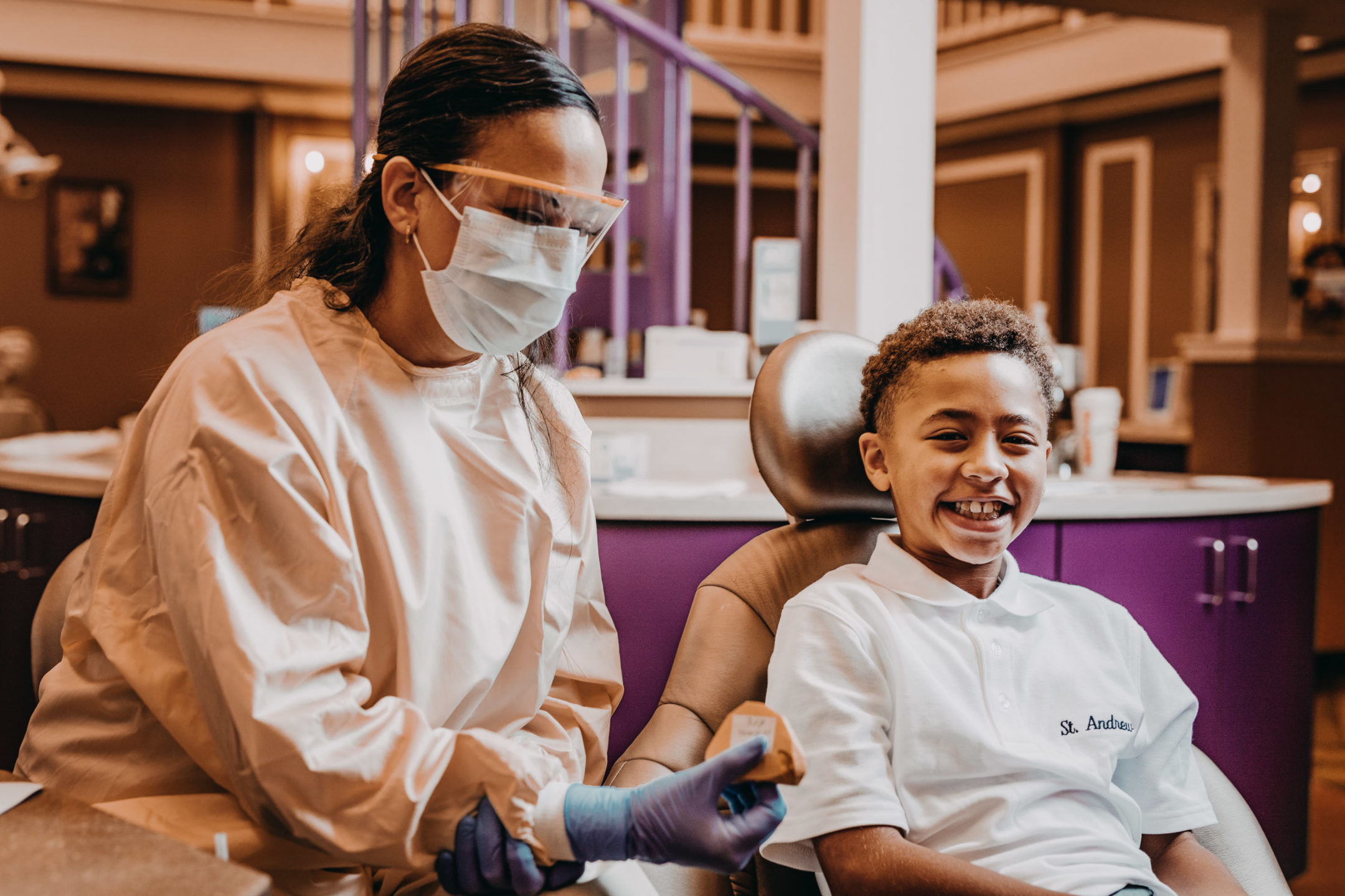 Young boy smiles during a visit to the orthodontist. 
