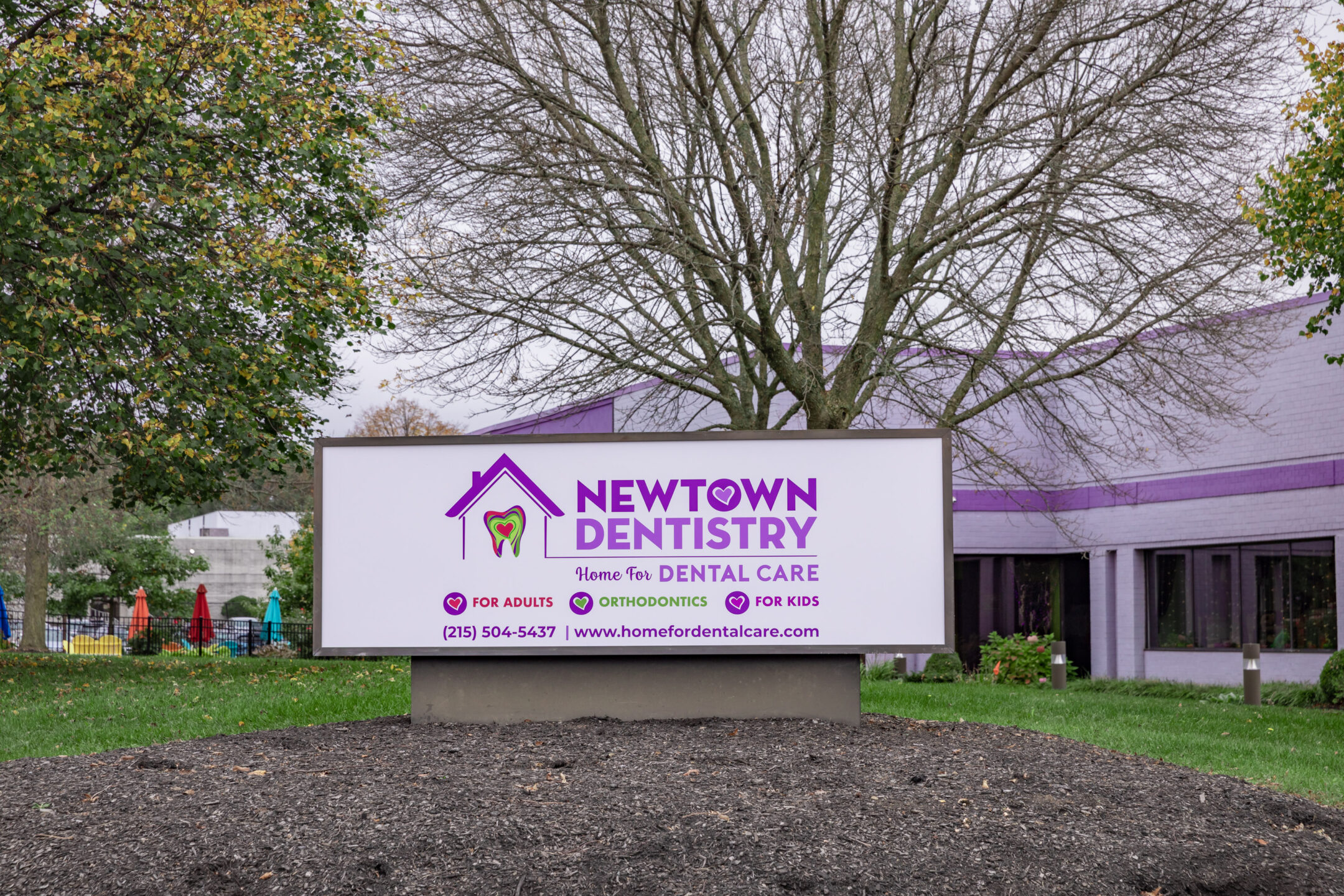  The sign in front of Newtown Dentistry, where people can find out about infected teeth extraction & other oral care. 