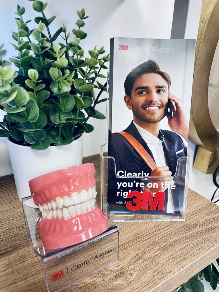 Image of clear aligner model on display in dentist office