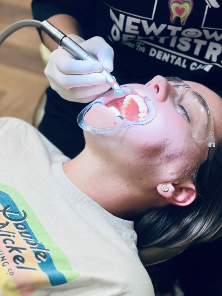 Patient getting their new clear aligner in dental chair