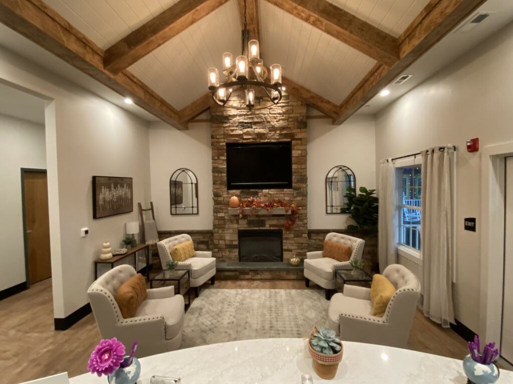 A dental reception area includes comfortable chairs and a fireplace.