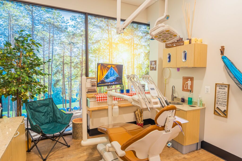 A relaxing dental exam room is decorated like a cabin in the woods.